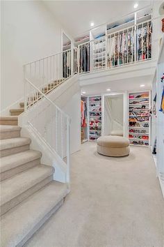 this is an image of a large closet with many items on the shelves and stairs