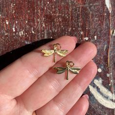 A sweet little dragonfly charm to add to your collection. 18k gold filled, measures 20x15mm. *Charms are made with sterling, filled, and base metals, glass, resin, clay (ceramic), as well as other materials and will wear over time. To keep your charms as brilliant as possible for as long as possible, avoid getting charms wet and wearing them to bed.  Please be gentle with charms and clasps and handle your pieces with care. Dragonfly Charm, Resin Clay, Lucky Charms, Clay Ceramics, Lucky Charm, Base Metal, Pendant Necklaces, Halloween Shopping, Gold Filled