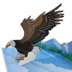 an eagle is flying in the air with its wings spread