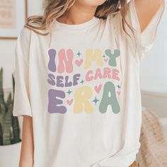 In My Self Care Era T-Shirt NOTE* Please be sure to check the size chart photo! We recommend measuring one of your tees at home and comparing it with the size chart. ABOUT OUT T-SHIRT: * All our T-shirts are high quality, super soft and comfortable; * This t-shirt comes with a lightweight fabric (4.2 oz/yd² (142 g/m; * Soft 100% cotton, quality print, ribbed knit collars, tapered shoulders, and dual side seams for lasting shape; * Bella+Canvas manufactures all its products in the USA; * Fabric b Self Care Shirts, My Self, Trendy Shirts, Look Plus, Shirt Price, Mens Tees, Lightweight Fabric, Solid Black, Bella Canvas