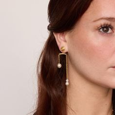 Why it's special: The kinetic movement of this design is our nod to Alexander Calder and his famous mobile sculptures. Simply pull either pearl at the end of the chain and enjoy endless variations. Two earrings in one for added versatility Lightweight stud drop earrings for easy wearing all day (and night!) Made of recycled sterling silver or 24 karat premium yellow gold plating and pearls Free and easy returns on domestic orders Mobile Sculpture, Stud Drop Earrings, Earrings With Pearls, Alexander Calder, Jewelry Cleaning Solution, Pearl Stud Earrings, Ring Size Guide, Recycled Sterling Silver, Day And Night