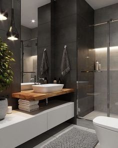 a bathroom with a sink, toilet and shower stall in it's own area