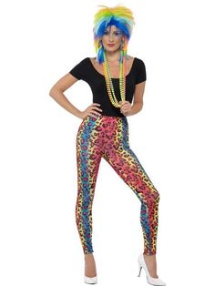 a woman with colorful hair is posing for the camera wearing leggings and heels