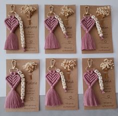 six different key chains with tassels and flowers on them are arranged in rows