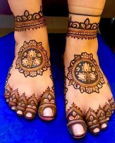 the feet are decorated with henna designs