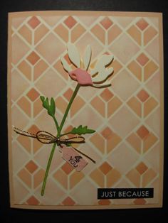 a card with a pink flower on it