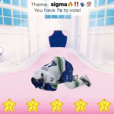 the hockey player is laying down on the ground in front of three stars and an empty room