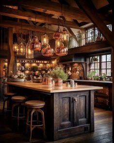 a large kitchen with wooden floors and lots of lights hanging from the ceiling above it