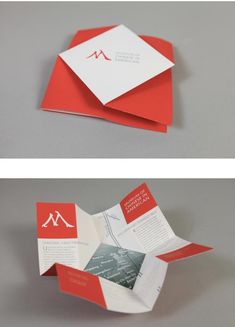 an open red and white folded brochure sitting on top of a gray surface