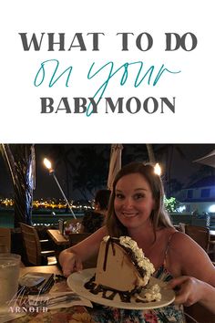 a woman sitting at a table with a cake in front of her and the words, what to do on your baby moon