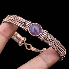 Amethyst Cuff Bracelet Amethyst Gemstone Bangle Copper Wire Wrapped Cuff Bangle Wire Wrap Bracelet Jewelry Handmade Copper Bangle Bracelet Main Stone - Amethyst Bangle Length - 2.50 - 2.75" Inches (Adjustable) Bangle Width  -  0.50 Inches Metal                  -  Copper Copper Has Been Used For Jewelry Making For Thousands Of Years, Dating Back To Ancient Civilizations Such As The Egyptians, Romans, And Aztecs. Copper Was Valued For Its Beauty, Versatility, And Durability, And Was Often Used To Adjustable Purple Bohemian Cuff Bracelet, Purple Amethyst Bangle, Amethyst Cuff Bracelet As Gift, Adjustable Purple Bangle With Gemstone, Adjustable Purple Gemstone Bangle, Amethyst Cuff Bracelet In Purple For Gift, Purple Amethyst Cuff Bracelet Gift, Amethyst Gemstone Bangle, Adjustable Purple Amethyst Ring