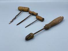 five old woodworking tools are laying on the table