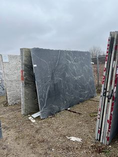 several pieces of granite sitting on the ground