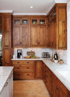 a kitchen with wooden cabinets and marble counter tops in the center is an advertisement for international bamboo doors