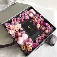 a box that has some flowers in it