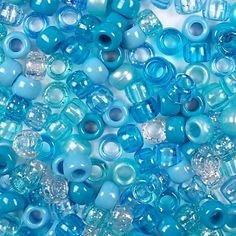 blue glass beads are shown in this close up photo