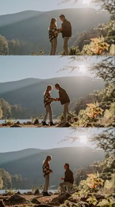 two people standing on top of a mountain next to each other