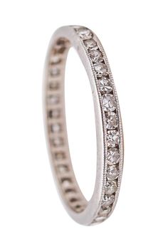 a white gold wedding ring with rows of diamonds on the inside and outside of it