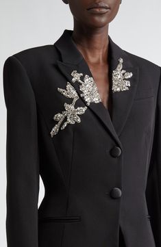 A subtle hourglass shape highlights the season's '50s inspiration in this wool-blend grain de poudre blazer featuring a stunning floral appliqué adorned in glittering crystals. A tribute to operatic icon Maria Callas, this collection incorporates hallmarks from the famous soprano's heyday. Front button closure Peaked lapels Four-button cuffs Chest welt pocket; front welt pockets Lined 50% wool, 50% viscose Dry clean Imported Designer Clothing Applique Fashion, Jacket Ideas, Embellished Clothing, Maria Callas, Hourglass Shape, Satin Midi Skirt, Silk Suit, It Goes On, Star Style