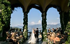 a bride and groom standing at the end of their wedding ceremony