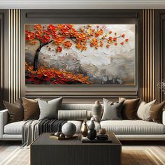 a living room with couches and paintings on the wall in it's center