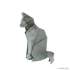 an origami cat sitting on its hind legs