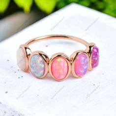 Pink Opal Ring, Vintage Opal Band, Opal Wedding Band, Rose Gold Opal Ring, Dainty Opal Ring, October Birthstone Ring, Matching Band Ring It is a very versatile ring and you can easily pair this ring with round gemstones or the stones with clean geometric lines. You can choose this ring as an alternative engagement band or you can use this to your stack for the hint of Emerald elegance.  Welcome to BlushJewelryStudio JUST OPENED- Experience beautiful jewelry that complements your everyday style, Luxury Rose Gold Opal Jewelry, Pink Granite And Opal Ring, Opal Sapphire Ring, Adjustable Multi-stone Stackable Rings For Wedding, Opal And Sapphire Ring, Opal Wedding Ring Set, Pink Opal Ring, Opal Ring Vintage, Rose Gold Opal Ring