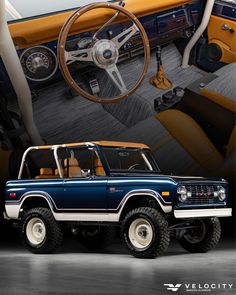 an old blue truck is parked in front of a car with the steering wheel up