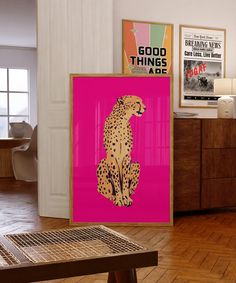 a pink poster with a cheetah sitting on it's side in the middle of a room