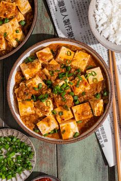 tofu and rice served in bowls with chopsticks