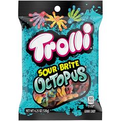 trolli sour brittle octopus candy bag on a black background with sprinkles