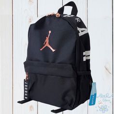 Nwt Nike Air Jordan Jumpman Small Travel Black Backpack With Bottle Pocket Sturdy Woven Fabric For Durability Front Zipper Pocket Provides Easy Access Main Compartment Features Wall Pocket For Small Items Padded And Adjustable Shoulder Straps Zipper Closures 100% Polyester 13" H X 10" W X 5" D Imported. 100% Authentic Guaranteed Item Is Going To Be Shipped Same To 1 Business Day Mochila Nike, Nike Backpack, Nike Bags, Black Kids, Black Backpack, Nike Jordan, Small Items, Nike Air Jordan, Black Nikes