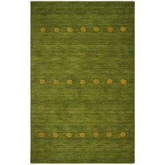 a green rug with gold dots on the bottom and an area rug in the middle