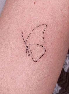 a single line butterfly tattoo on the arm