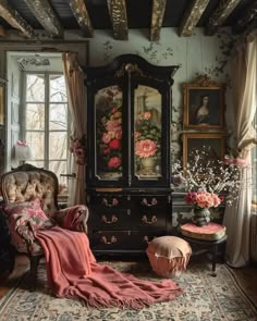 an old fashioned bedroom with floral wallpaper and antique furniture, including a large armoire