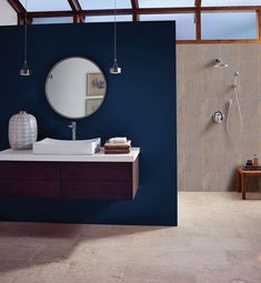 a bathroom with blue walls and white flooring