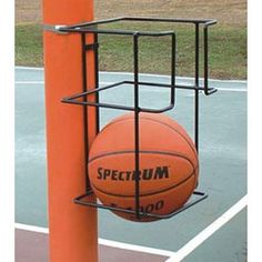 an orange basketball sitting on top of a metal rack