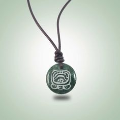 Ajmaq Leather Necklace (26mm) - Jade Maya Symbolic Medallion Necklace For Gift, Spiritual Carved Medallion Necklaces, Handmade Symbolic Medallion Necklace As Gift, Symbolic Carved Necklace For Gifts, Adjustable Carved Amulet Style Necklaces, Adjustable Round Medallion Necklace As Gift, Adjustable Large Pendant Medallion Necklace Gift, Carved Amulet Necklace With Round Pendant, Spiritual Carved Round Pendant Necklaces