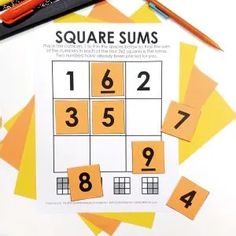 a square summ game with numbers and pencils next to it