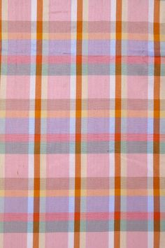 an orange, pink and blue plaid fabric