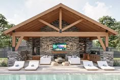 an outdoor living area with couches and a television on the wall next to a swimming pool