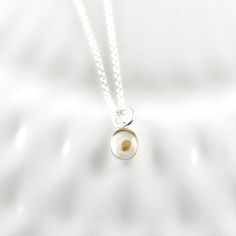 "\"Truly I tell you, if you have faith as small as a mustard seed, you can say to this mountain, 'Move from here to there,' and it will move. Nothing will be impossible for you.\" - Matthew 17:20 This dainty handmade sterling silver pendant is a single mustard seed set in resin in a sterling silver bezel. Each pendant is created in our studio using high grade resin for years of wear. Pendant measures just 8mm tall by 6mm wide (minus top loop) for a simple and understated look. This necklace will Faith Of Mustard Seed, Mustard Seed Bible Verse, Mustard Seed Necklace, Bible Verse Necklace, Seed Necklace, Matthew 17, Matthew 17 20, Hand Stamped Necklace, Mustard Seed