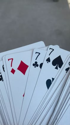 several playing cards stacked on top of each other