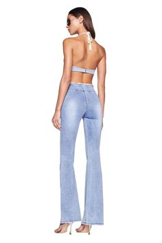 Details Best-selling Nevah Denim Pant Light Blue wash is back Low-mid rise waist and flared silhouette Flattering V-shaped waistband with fringe detailing Adjustable drawstring detail at front waist - Can be tucked in Features sandblasting effect on thighs and on behind Side seam zipper Recommended Underwear: Due to the low-rise fit, we recommend wearing this garment with a seamless low-rise brief Size and Fit True to size. We recommend wearing your standard size Low to mid rise. Rise is adjusta High Waist Medium Wash Flares With Five Pockets, Summer Fitted Medium Wash Flares, Fitted Medium Wash Flares For Summer, High Waist Light Wash Denim Flares, Light Wash Flare Jeans For Summer, High Waist Denim Flares With Five Pockets, Summer Flare Light Wash Pants, Light Wash Flare Pants For Summer, Summer Flare Jeans With Frayed Hem