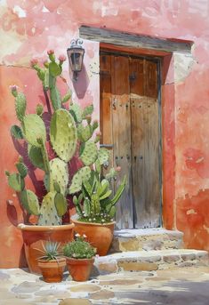 two potted plants sit on the steps in front of an adobe - style building