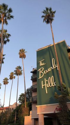 the beverly hills sign is shown in front of palm trees