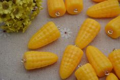 several pieces of yellow corn on a table