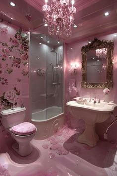 a bathroom with pink walls and flooring has a chandelier hanging from the ceiling