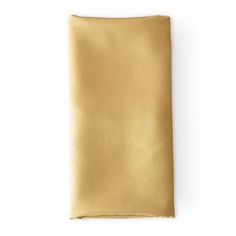 a gold colored pocket square on a white background