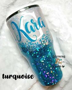 a blue glitter tumbler with the name kala on it